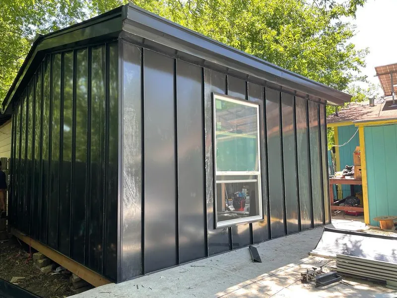 Black standing seam metal wall panels for Roof Inspection in Chamblee